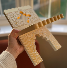 Load image into Gallery viewer, Decorative Quran koran wooden stand with intricate carvings held by a person indoors.
