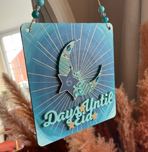 Load image into Gallery viewer, Decorative sign with 'Days Until Eid' text hanging indoors with pampas grass.
