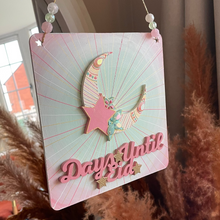 Load image into Gallery viewer, Decorative sign with a pink moon and star design, hanging indoors.