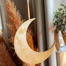 Load image into Gallery viewer, Decorative moon-shaped light with pampas grass against a neutral background
