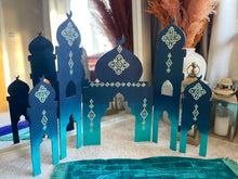 Load image into Gallery viewer, Decorative paper models of Islamic architectural elements on a textured surface.