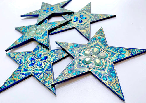 blue stars with mint green and teal painted details and gems